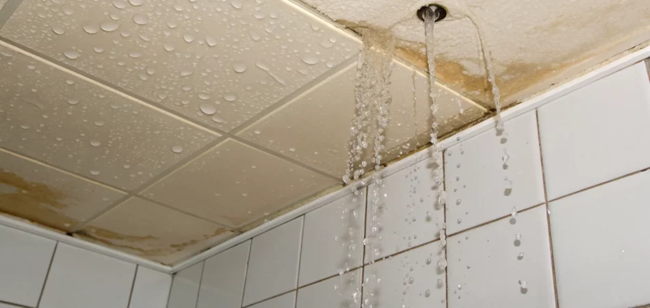 Water damage on a ceiling caused by a bathtub leaking to downstairs.